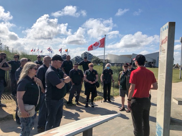 A guide leading guests through the D-Day story at the Juno Beach Centre
