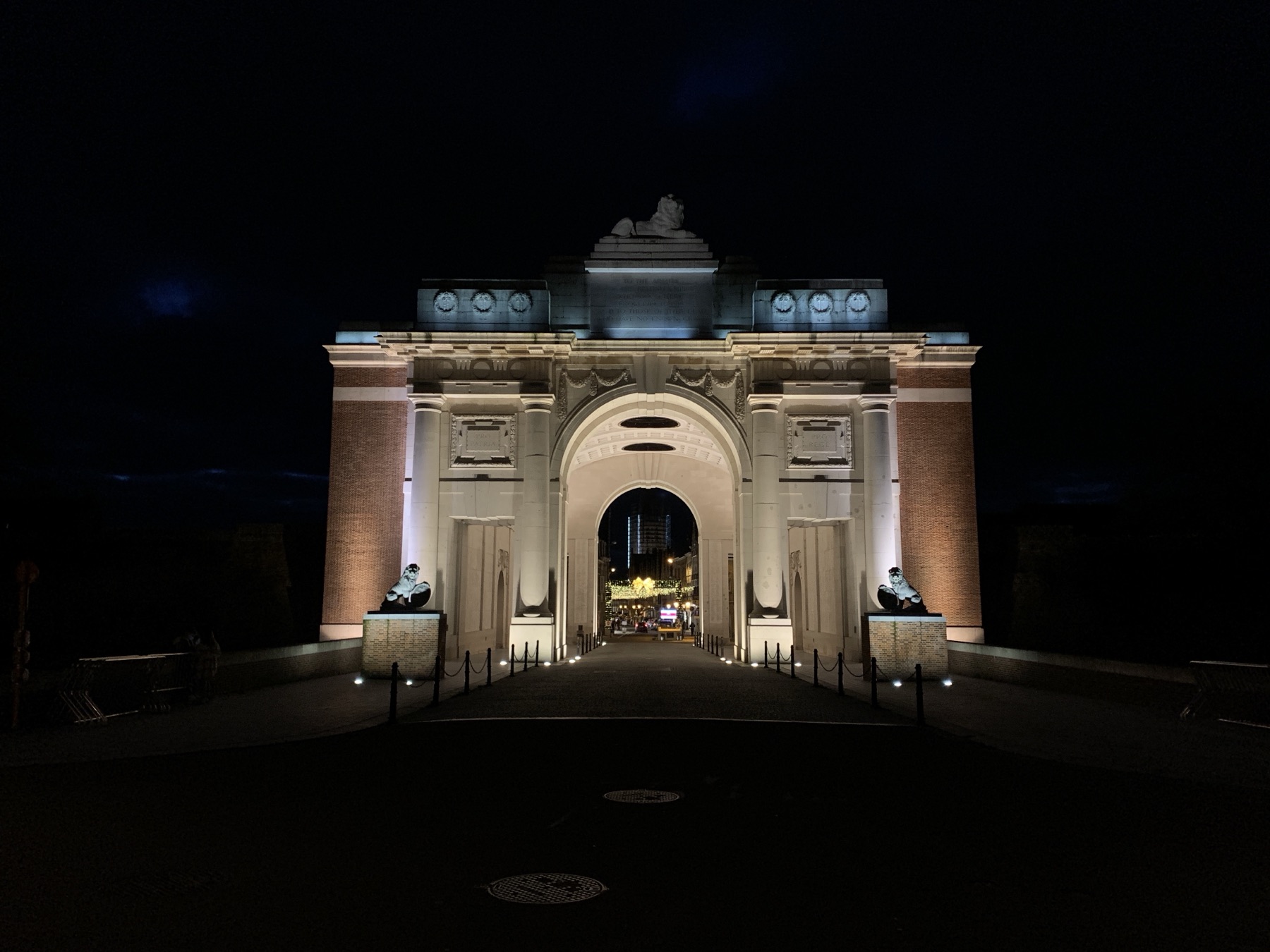 The Menin Gate Memorial illuminated at night in Ypres
